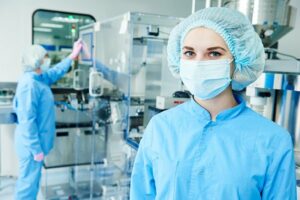 scientists in masks in a lab