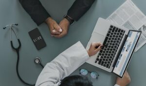 doctor & patient with laptop