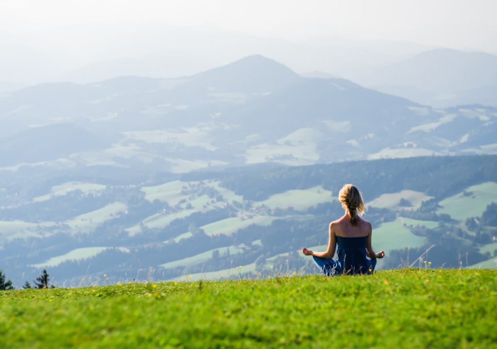 Meditating on a hillside