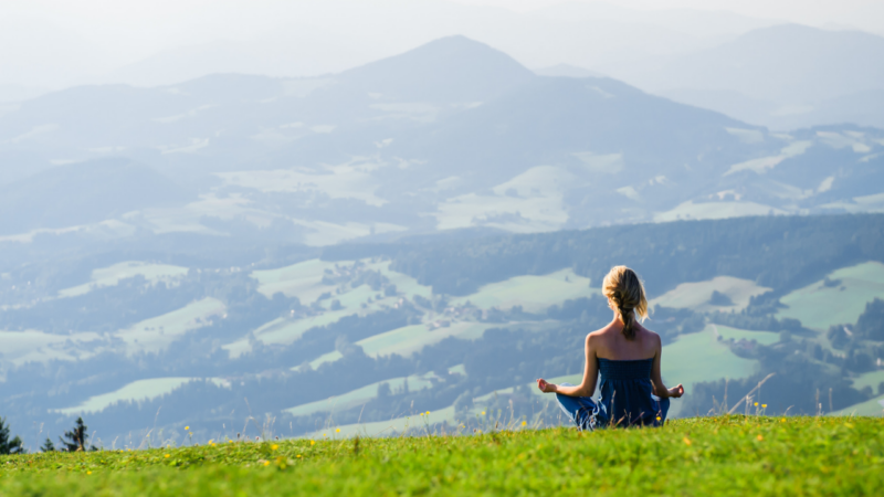 Meditating on a hillside