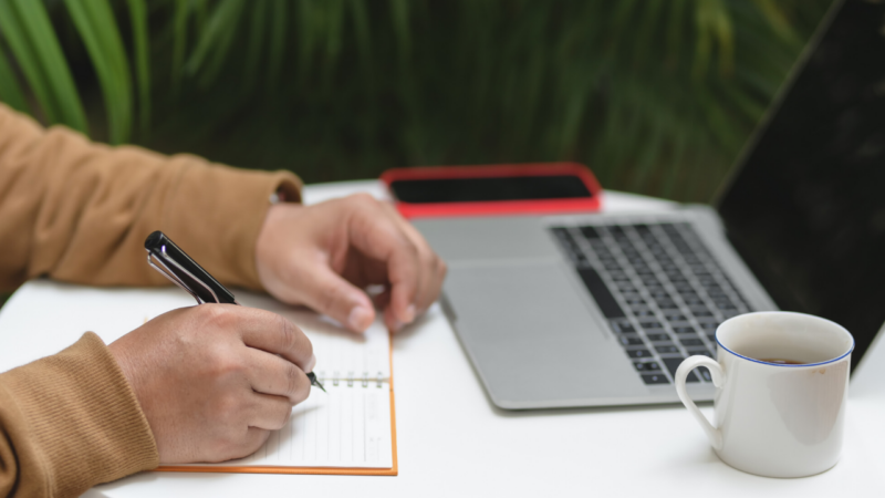 man working on notebook