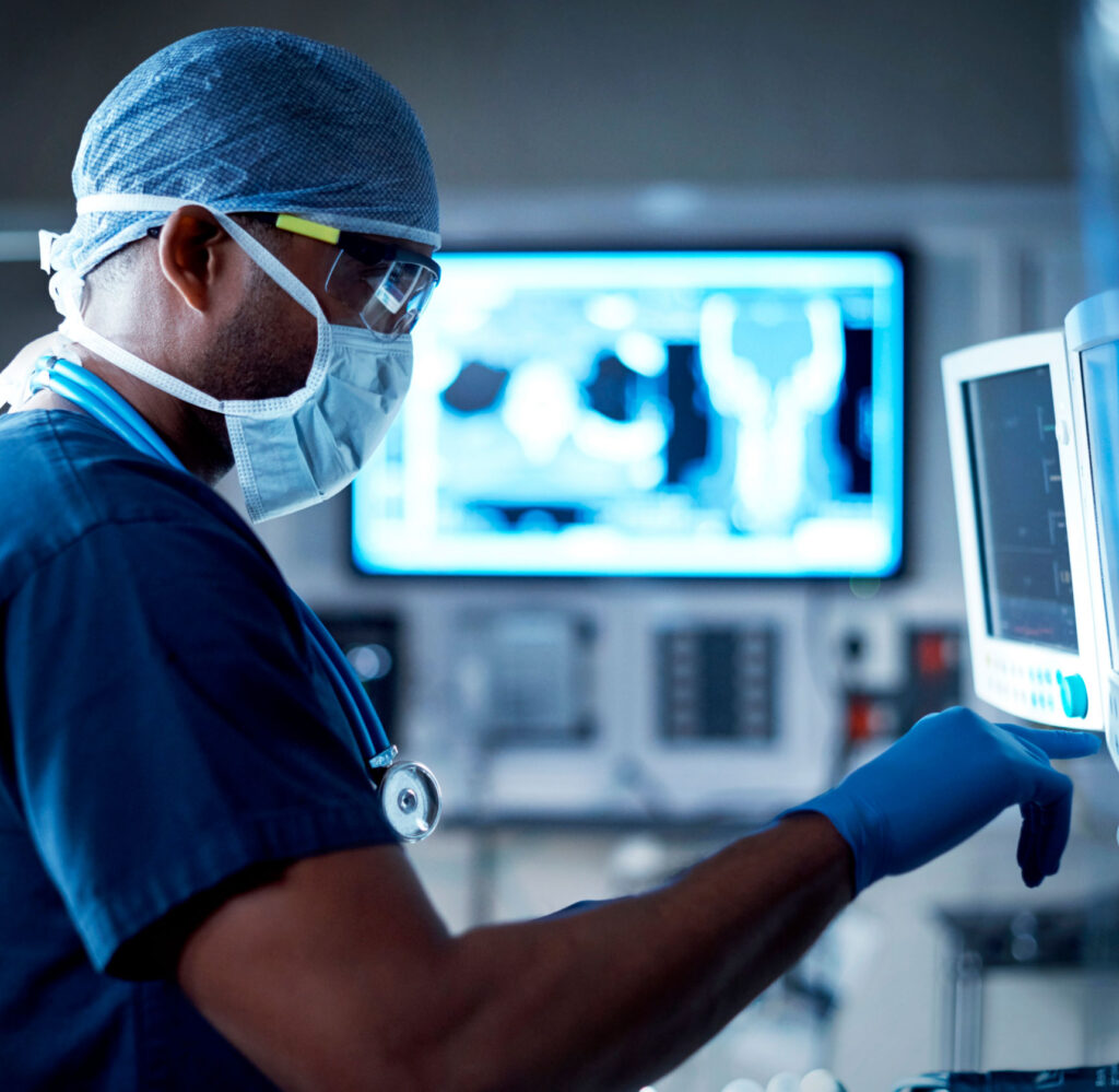 medical professional reading a screen