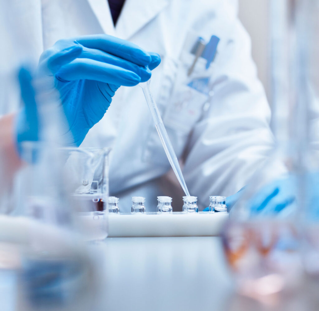 pipette going into a bottle