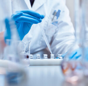 pipette going into a bottle
